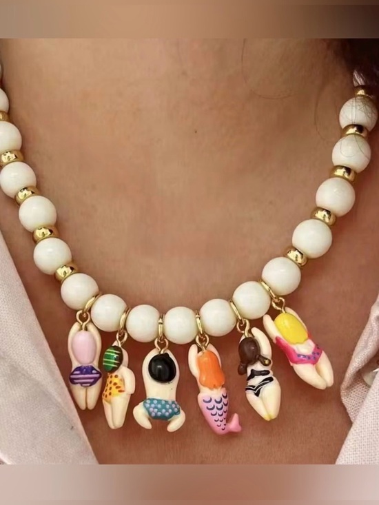 Anthropologie Jewelry - White Beaded Charm Necklace with Colorful Swimmer Charms